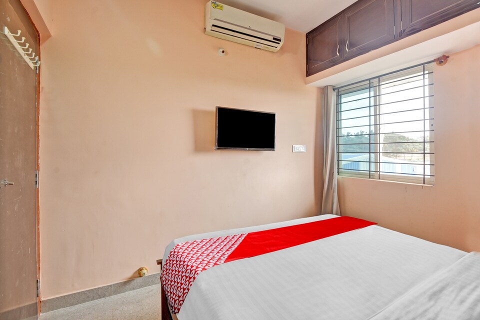 OYO 84336 Nandi Suite, Airport Road Bangalore, Bangalore