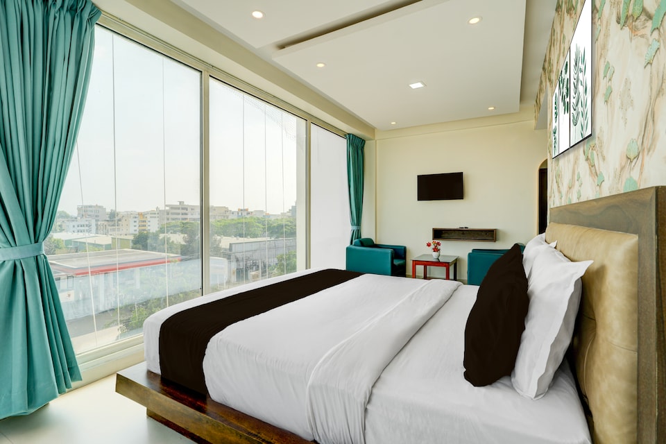 Hotel O Vaishnavi Suites, Airport Road Bangalore, बैंगलोर