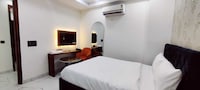 Hotel O Corporate Suites near Botanical Garden Metro Station