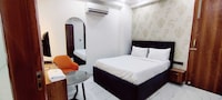 Hotel O Corporate Suites near Botanical Garden Metro Station