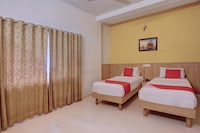 OYO The Woodbridge Hotel Near Ragigudda Sri Prasanna Anjaneyaswamy Temple